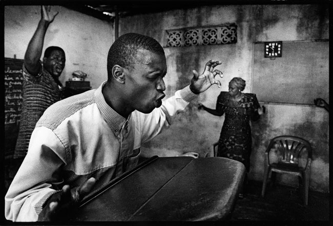 Ivory coast, Abidjan 2000, Ecstatic priest prays for protection against aids