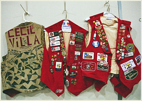 The guides and handelers adorn their vests with pins and snake charms.