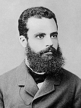 “Black-and-white portrait of Vilfredo Pareto, an Italian economist known for developing the Pareto Principle. He has a full beard and mustache, neatly groomed, and wears a formal jacket over 