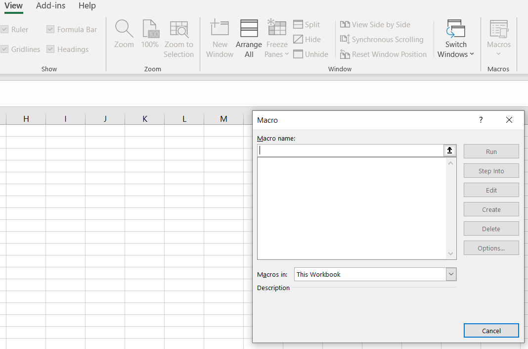A screenshot of the “Macro” window in Excel, where users can create or run macros. The window is blank, prompting users to input a macro name. The Excel interface in the background shows an e