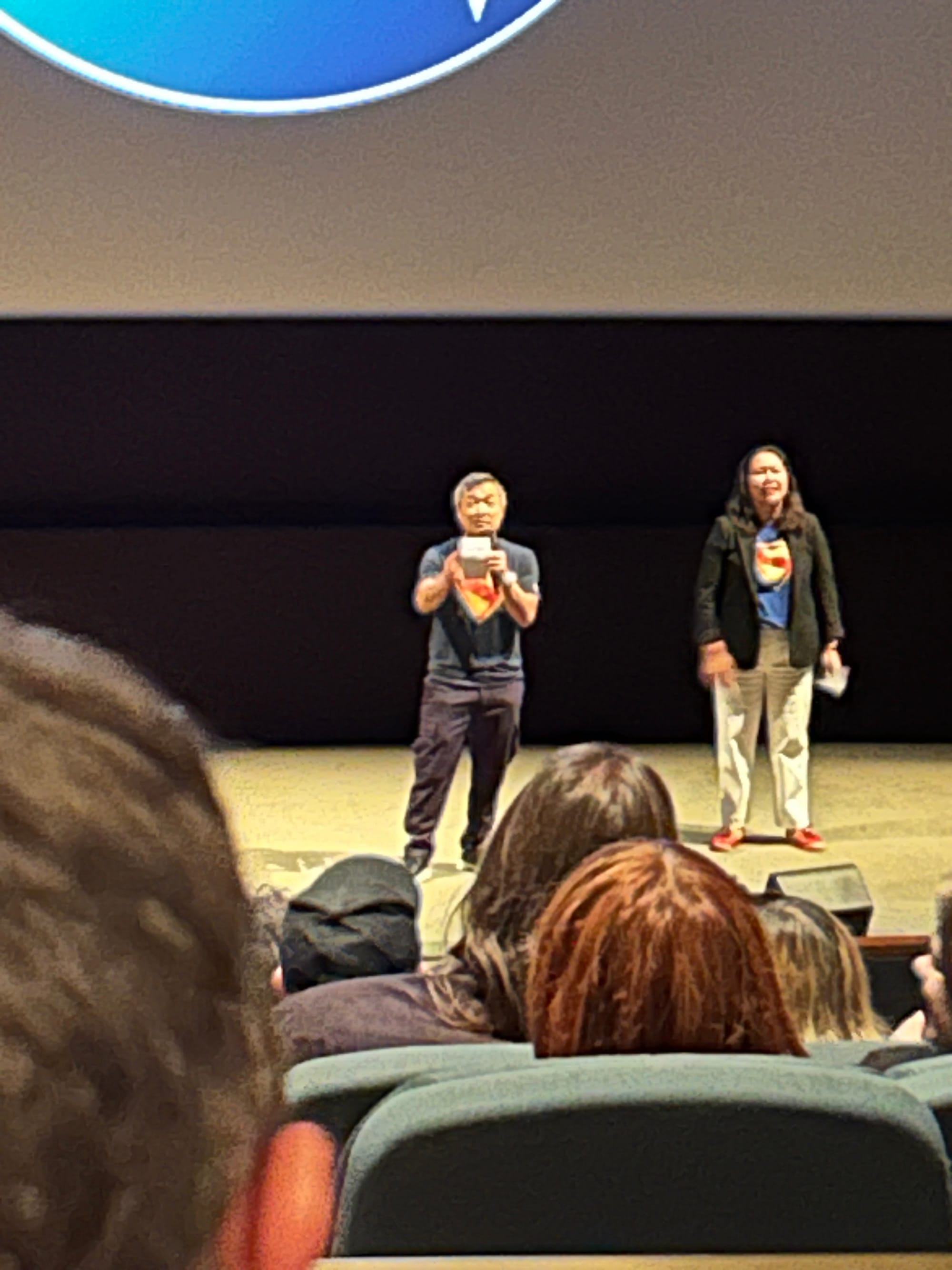 Jim Lee introducing the Superman film in the front of a movie theater