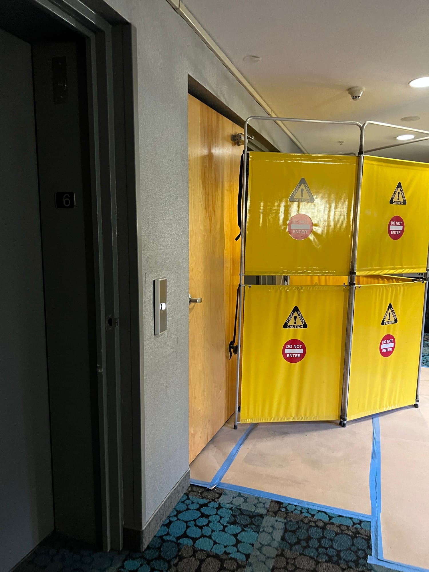 Caution/do not enter barriers set in front of elevators
