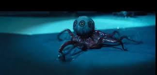 A still from alien earth of a small octopus, but the head has been replaced by a single eye with a bunch of different irises around its circumference.