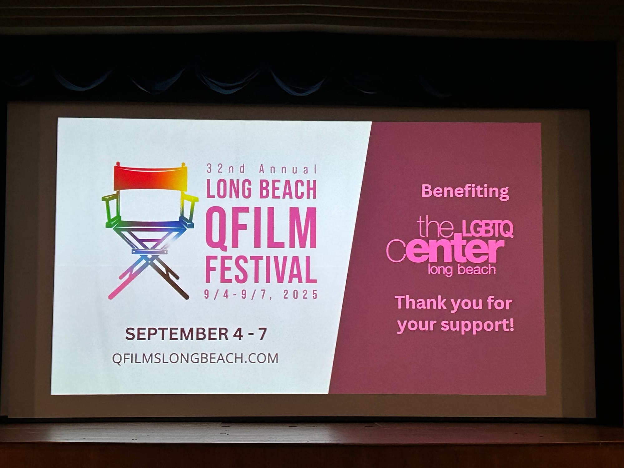 Long Beach QFilm Festival title card on the movie screen, benefiting the LGBTQ center long beach.