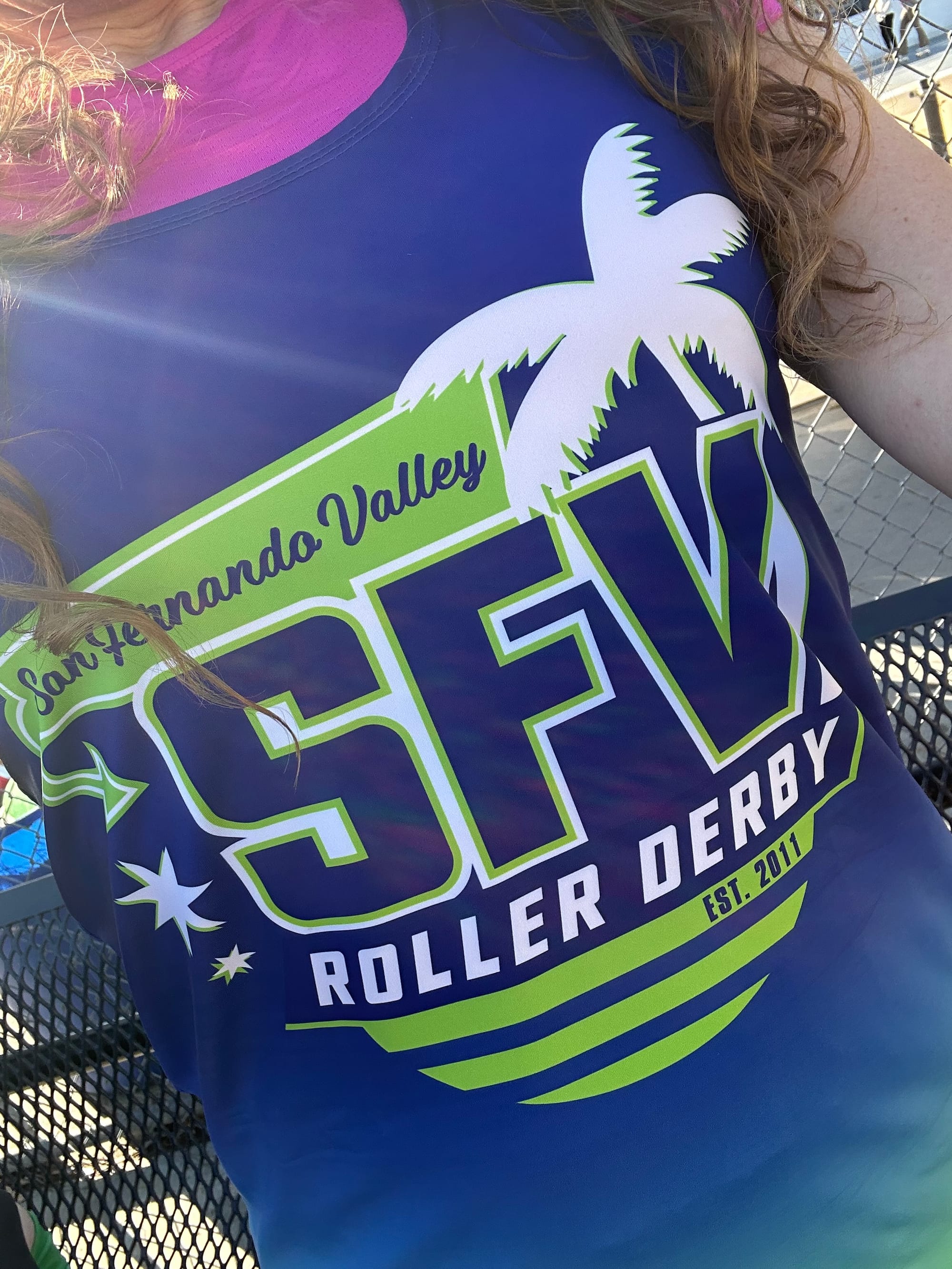 SFV roller derby logo in white and green on blue, with white stars and a white palm tree