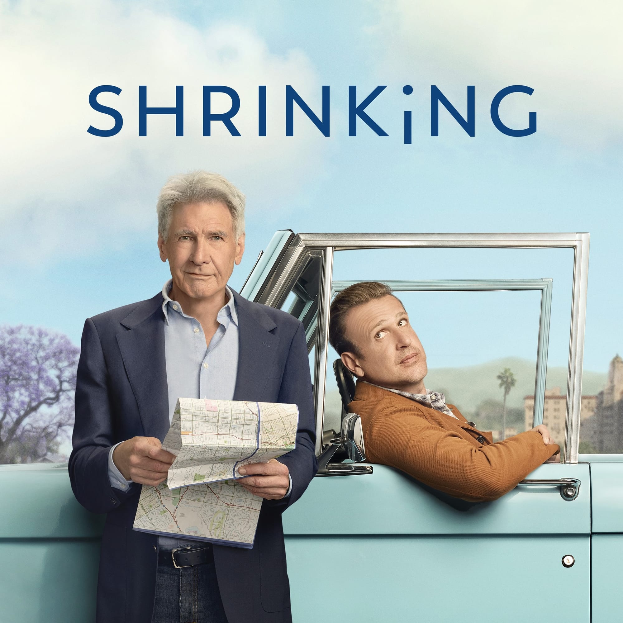 Shrinking key art showing Harrison Ford holding a map next to Jason Segel, who is sitting backwards in the driver’s seat of a car