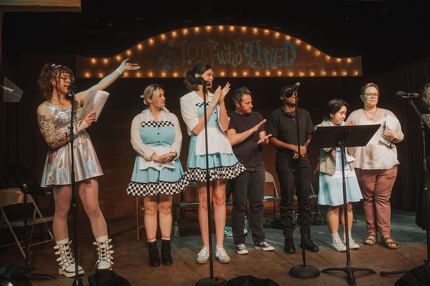 The full Robo Waitress Assassins cast on stage at the end of the production.