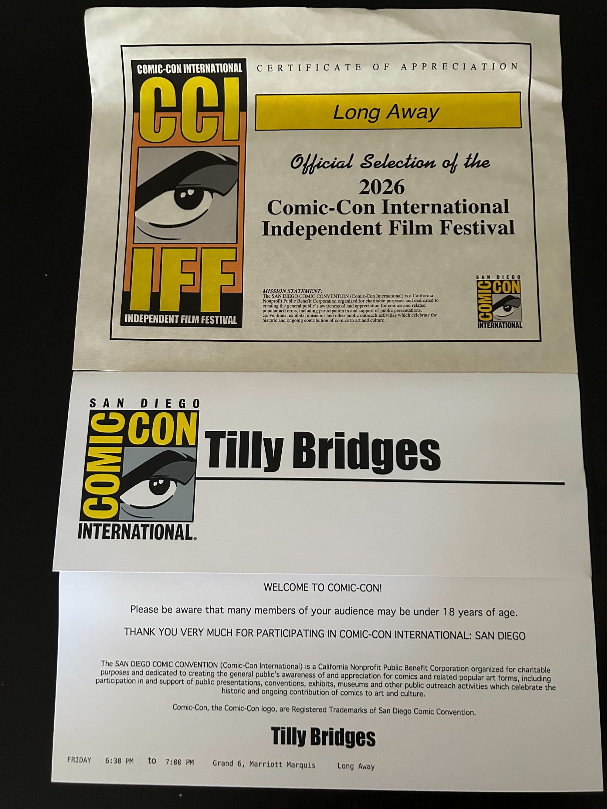 Long Away’s official selection of the CCIIFF certificate, and tilly’s panel name card, the back of which shows the time, date, and location of the screening and panel