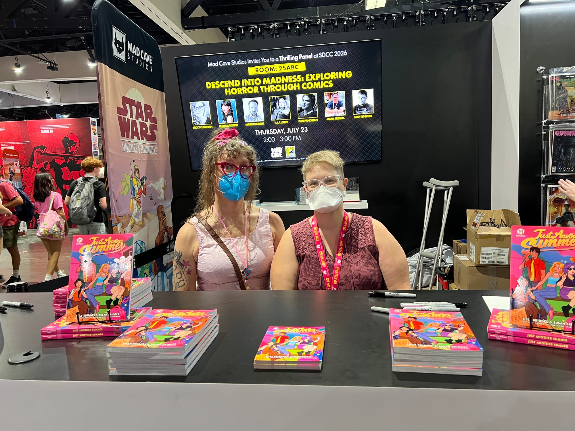 Us signing at the Mad Cave booth