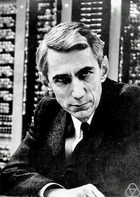 Photo of Claude Shannon in front of computer equipment. — https://opc.mfo.de/detail?photo_id=3807, CC BY-SA 2.0 de, https://c