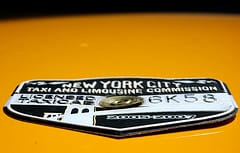 Taxi medallion pic by Sugar Sweet Sunshine on Flickr. Used under a creative commons license.