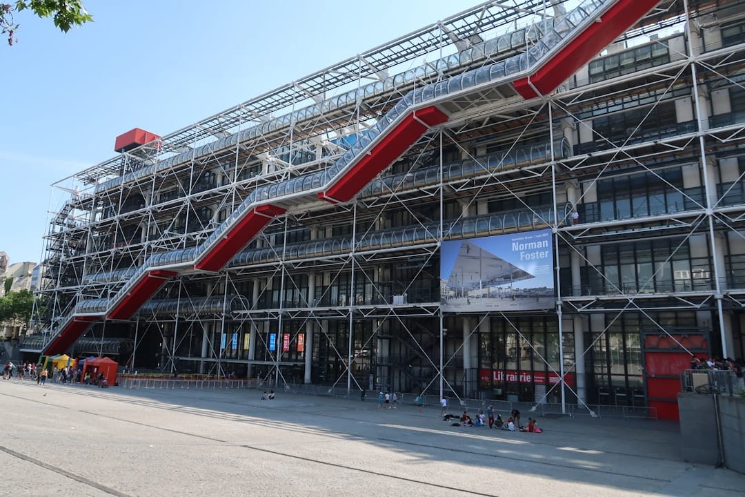 Interior view of the Centre Pompidou's open-plan gallery space with visitors viewing modern art installations.