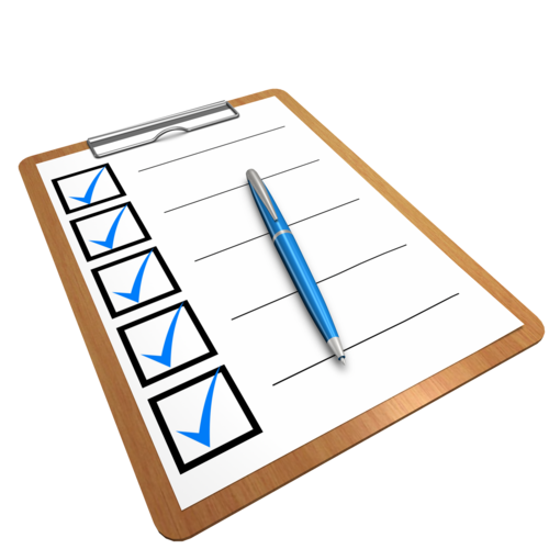 Piece of paper on a clipboard with several checked boxes