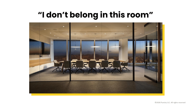 Photo of a slick-looking meeting room with floor-to-ceiling windows overlooking the city. Text reads "I don't belong in this room"