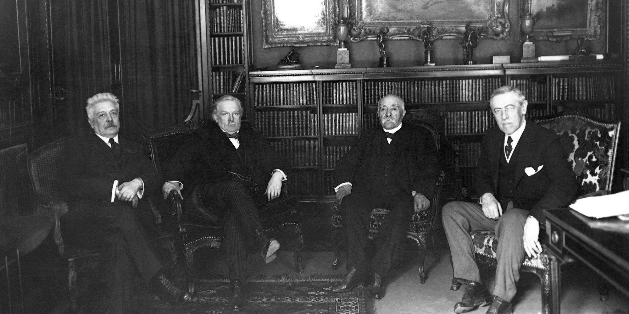 Vittorio Orlando, David Lloyd George, Georges Clemenceau, and Woodrow Wilson meet to discuss the Treaty of Versailles