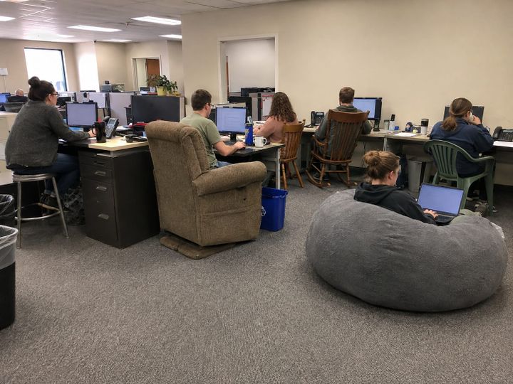 "Their chairs had abandoned them to become a giraffe, but nature abhors a vacant workstation."