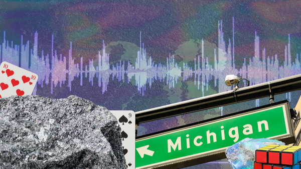 An image displaying a number of items related to the number 26, such as iron, opal, playing cards, Michigan, and a rubiks cube.