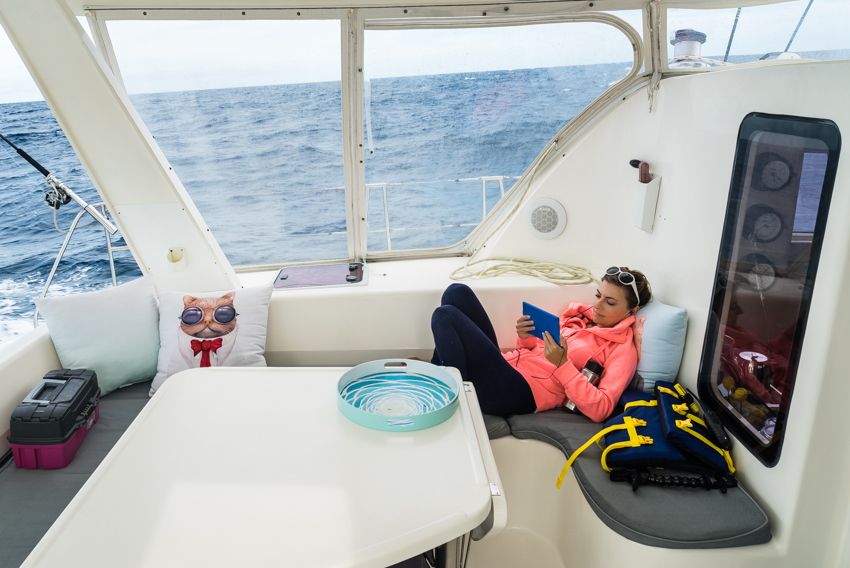 reading on a sailboat