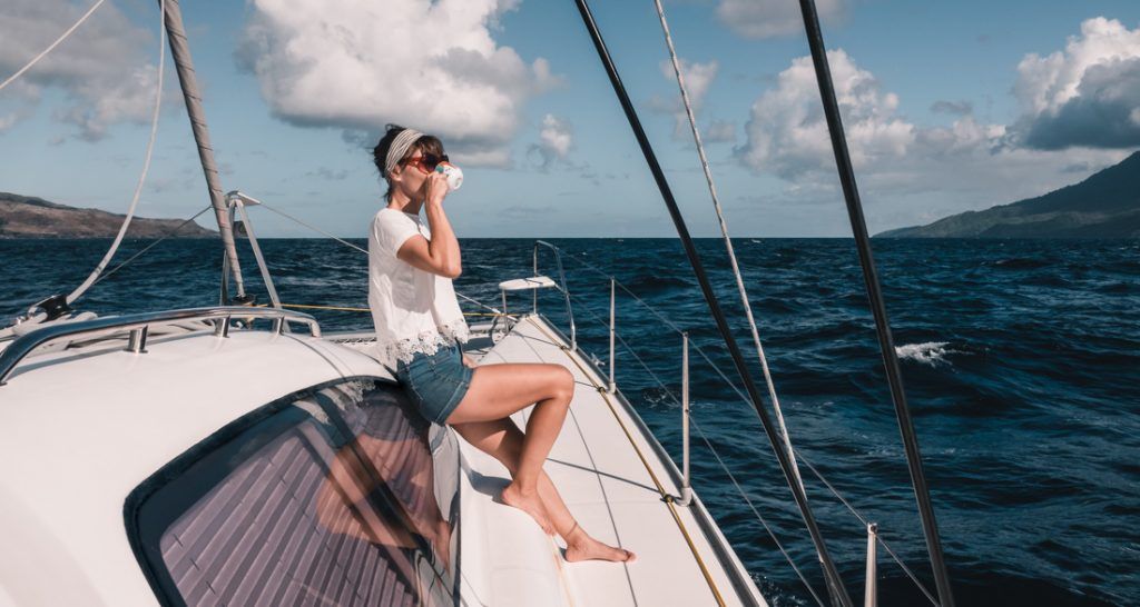 nikki wynn sipping coffee while sailing the marquesas