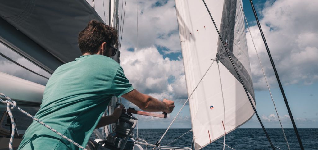 jason wynn trimming genoa on sailboat
