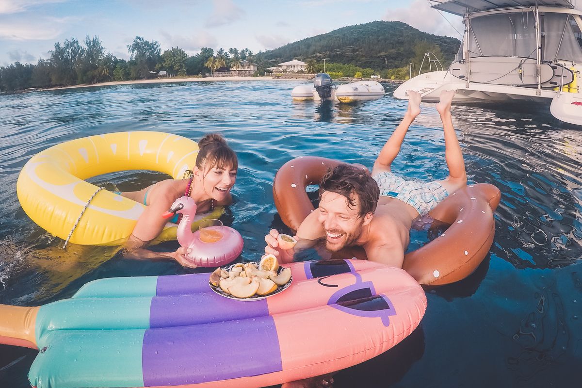 Jason and Nikki having silly Fun With pool floaties in the south pacific