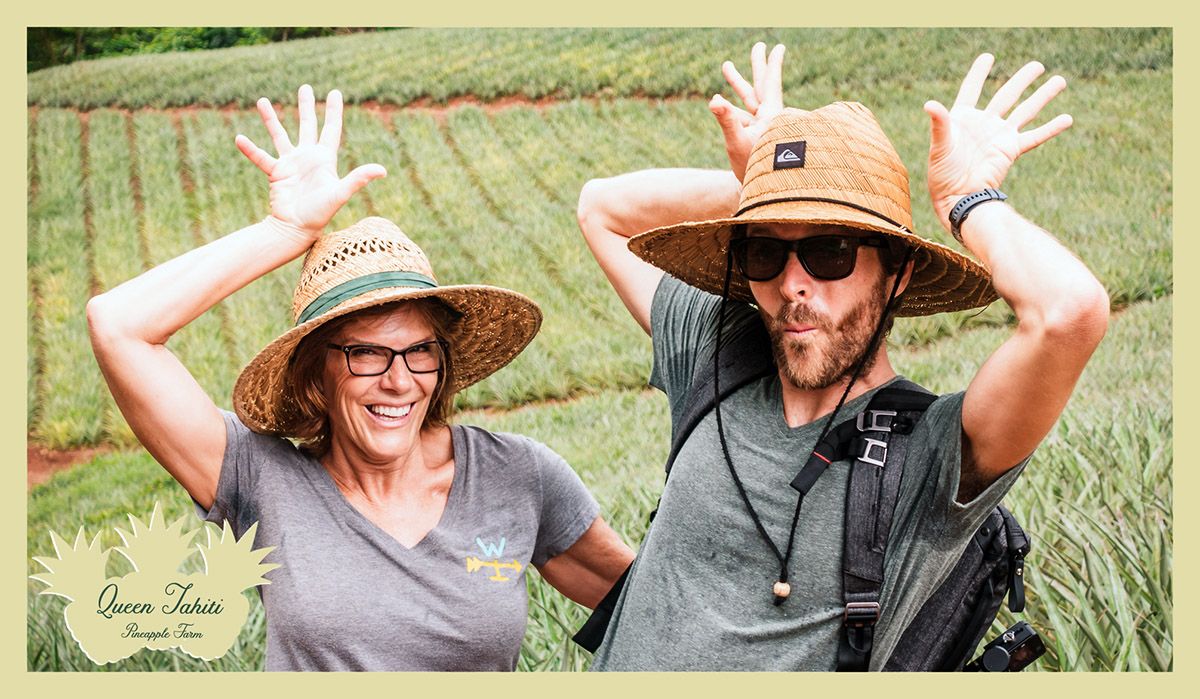 jason wynn and his mom posing as pineapples in moorea with pineapple farm in background