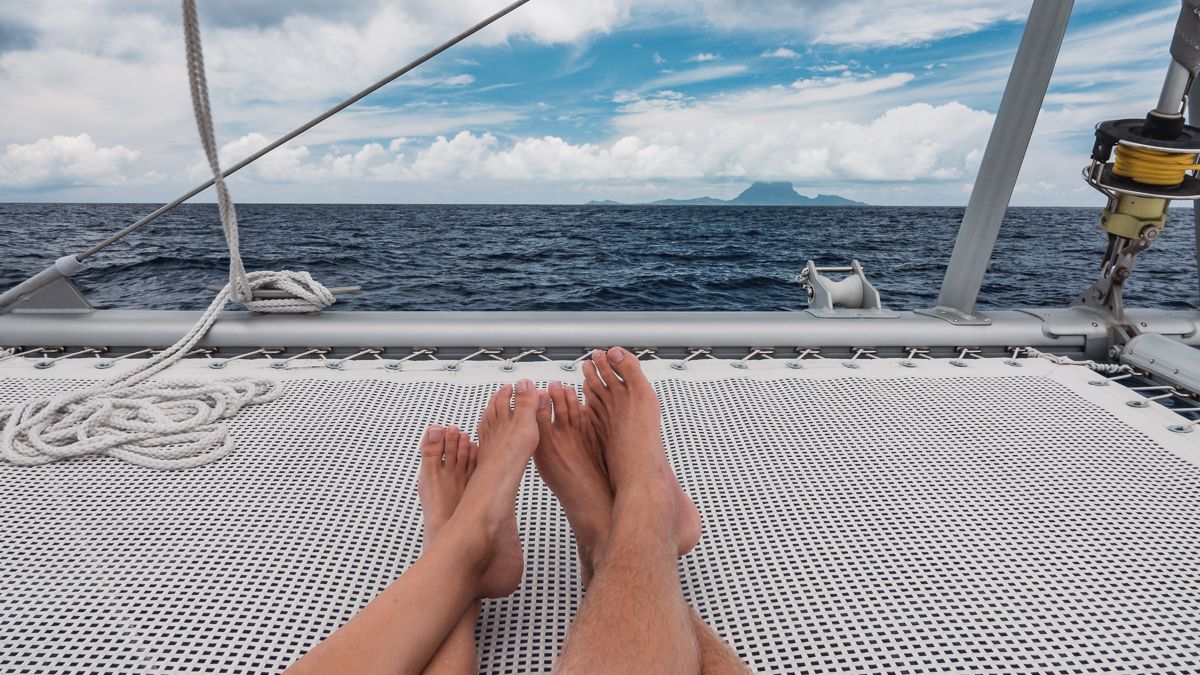 nikki and jason wynn cuddling while sailing to bora bora