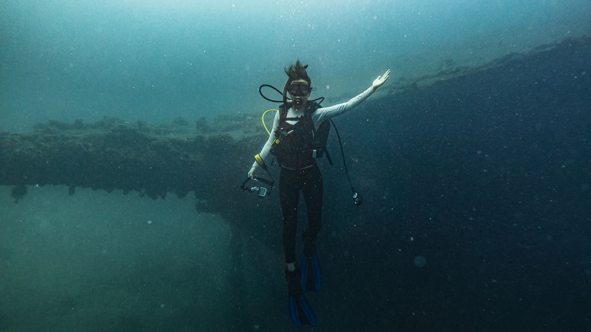 nikki wynn scuba diving a shipwreck in raiatea french polynesia
