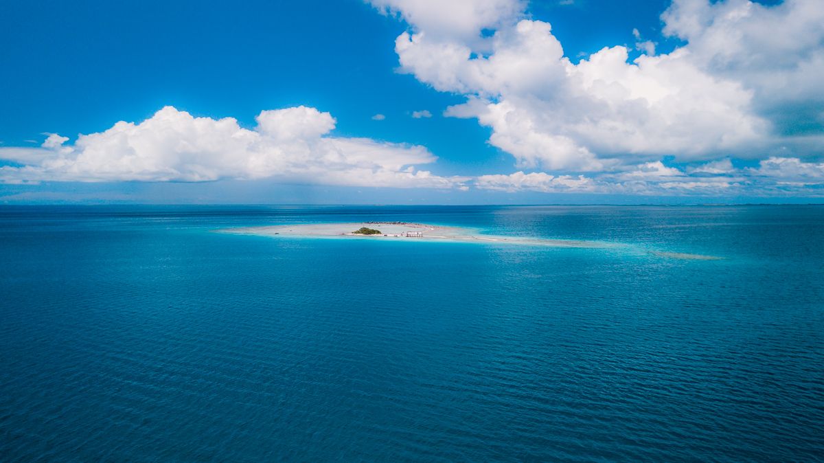 tiny motu inside an atoll in the south pacific