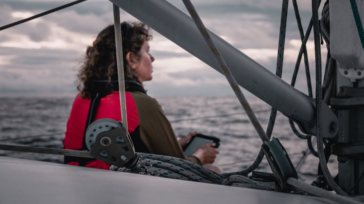 crew of sailing catamaran curiosity on passage to cook islands