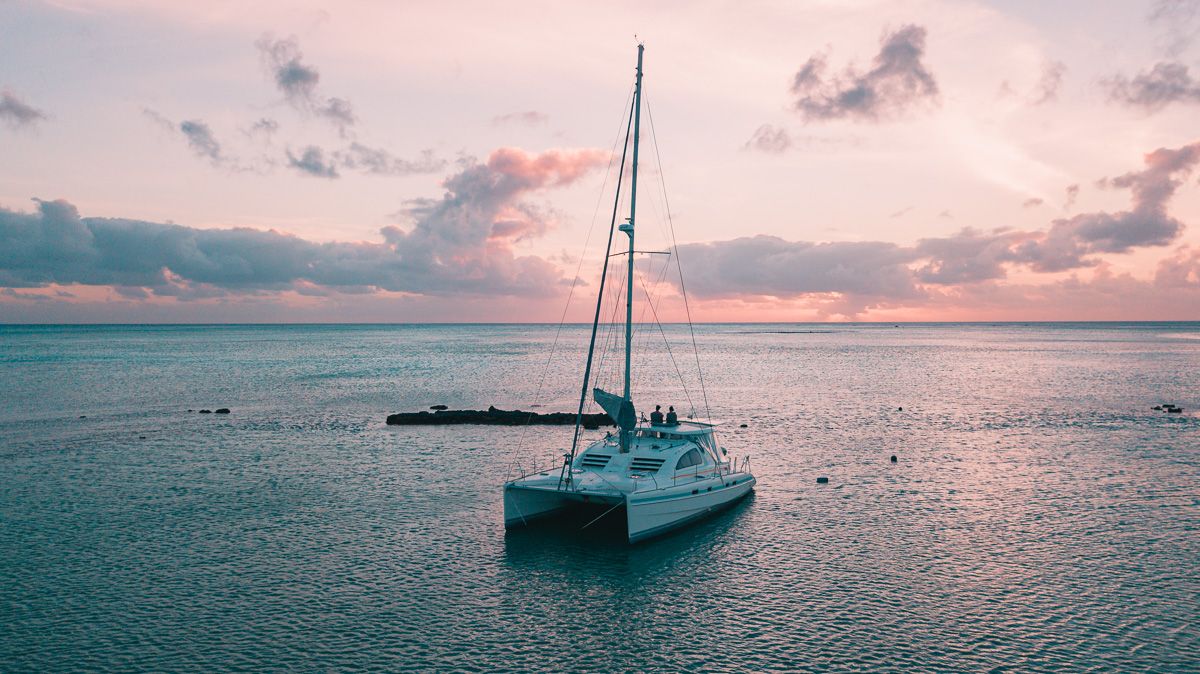 jason and nikki wynn sitting aboard Curiosity watching the sun go down in the south pacific