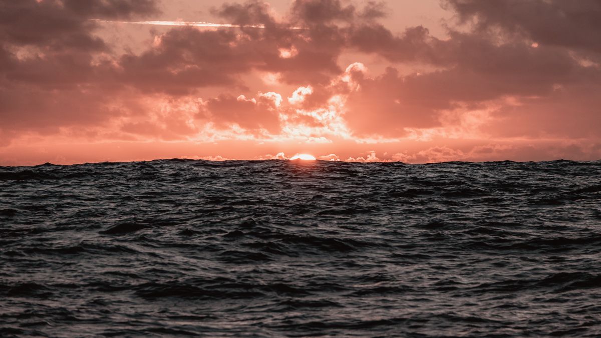 a golden sunset at sea in the south pacific