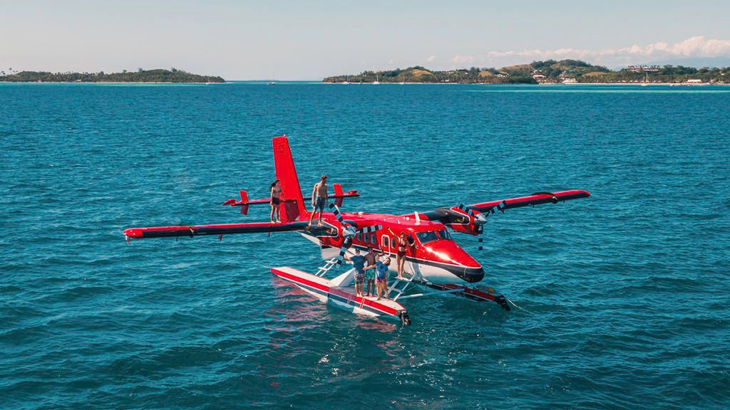 jason and nikki wynn with friends on asea plane adventures in fiji