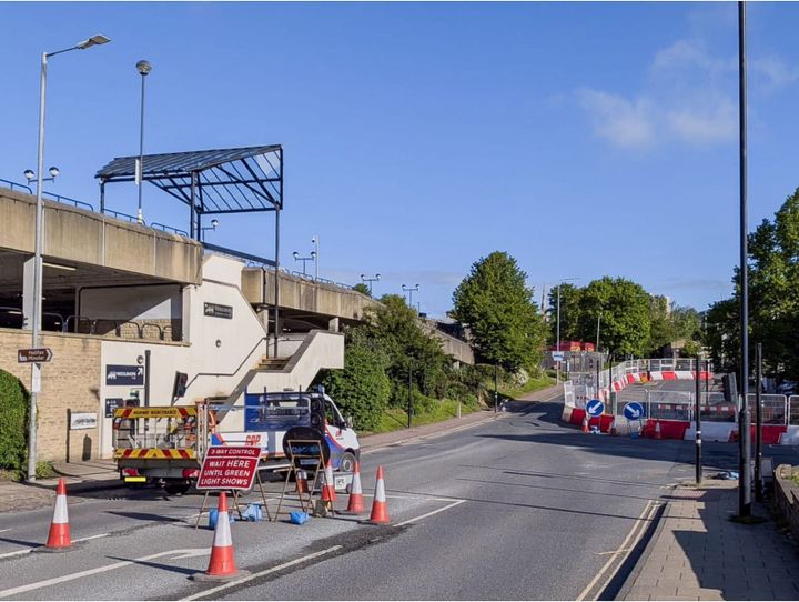 A quiet road with two sets of roadworks controlled by traffic lights