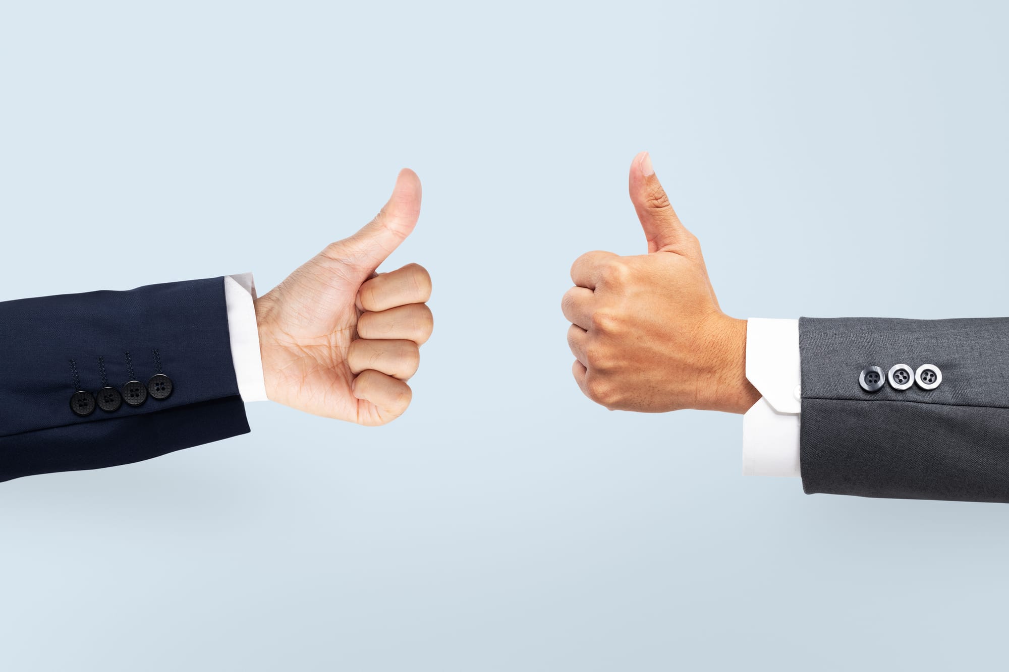 two hands making the pros gesture