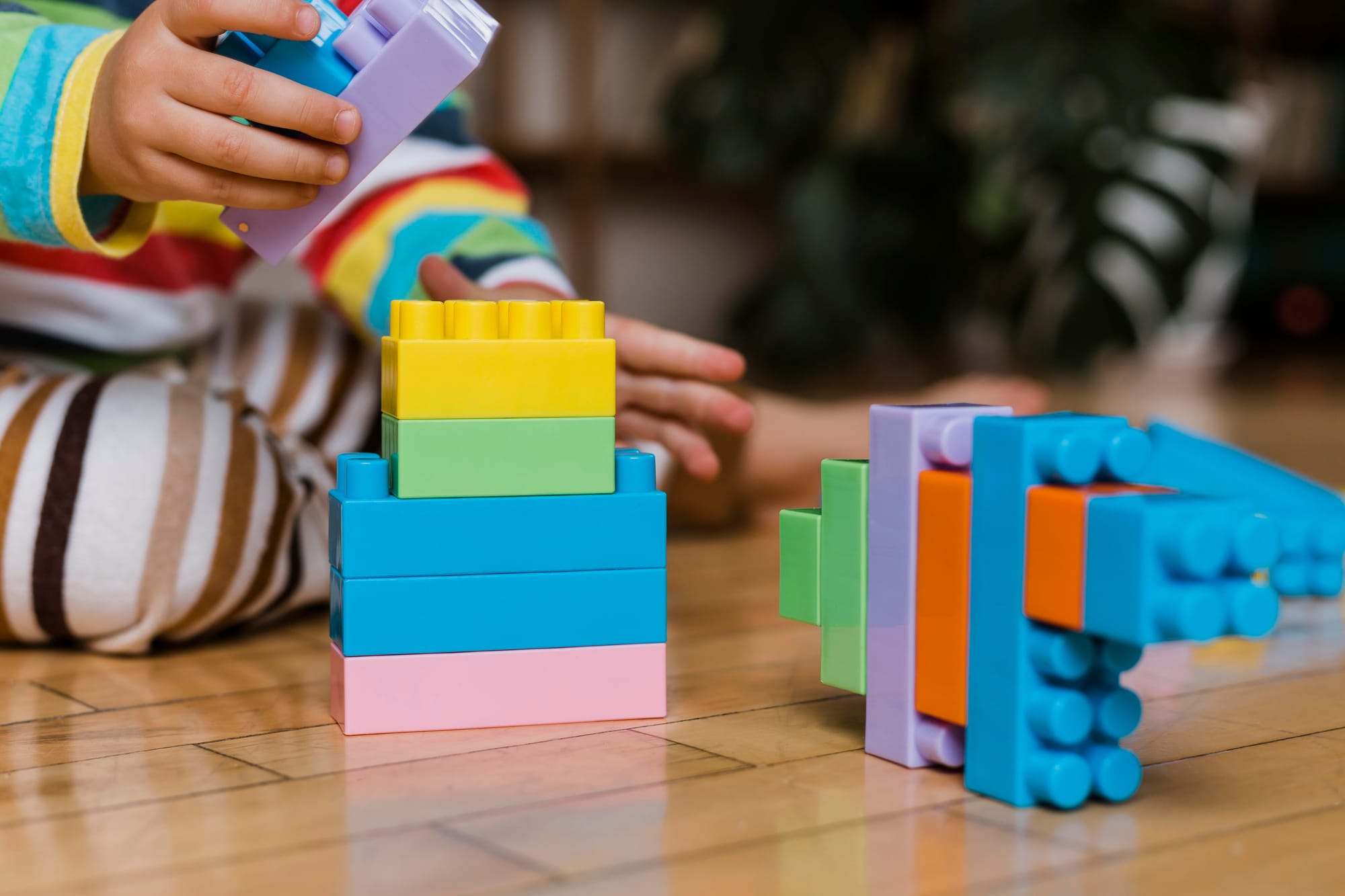 close-up-little-boy-playing-with-toys.jpg