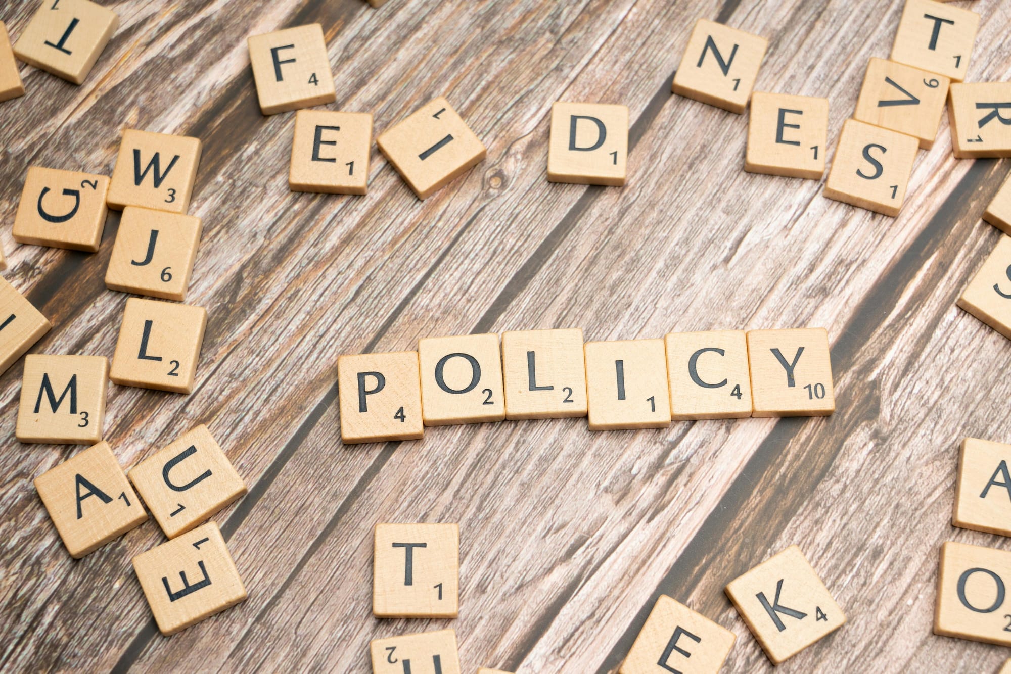 Reseller skills: the word "policy" spelled with scrabble tiles
