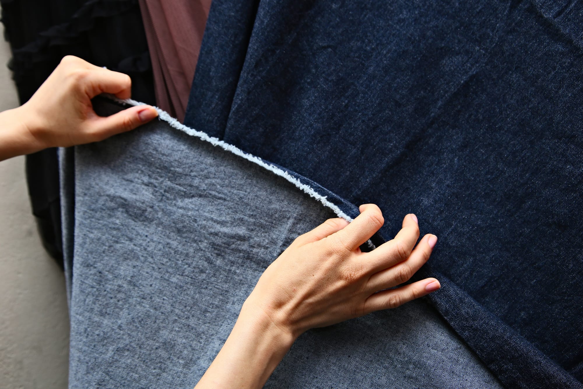 Checking the seams of a denim clothing