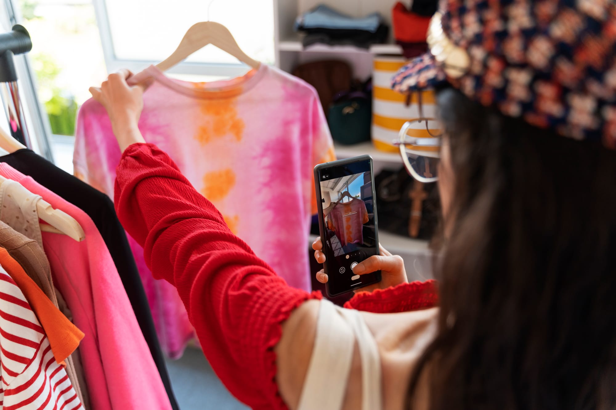woman taking a photo of an item for a listing