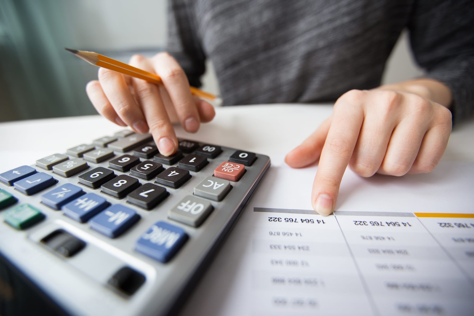 An accountant comparing fees for cosslisting apps