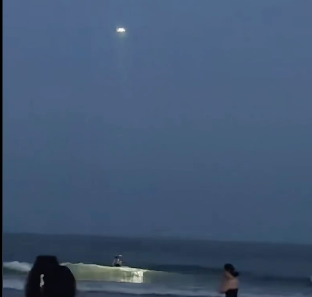 VIDEO | Drone in China won't let man swim in the ocean after dark.