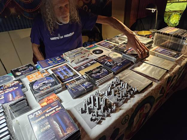 A person sitting at a table with many books
AI-generated content may be incorrect.