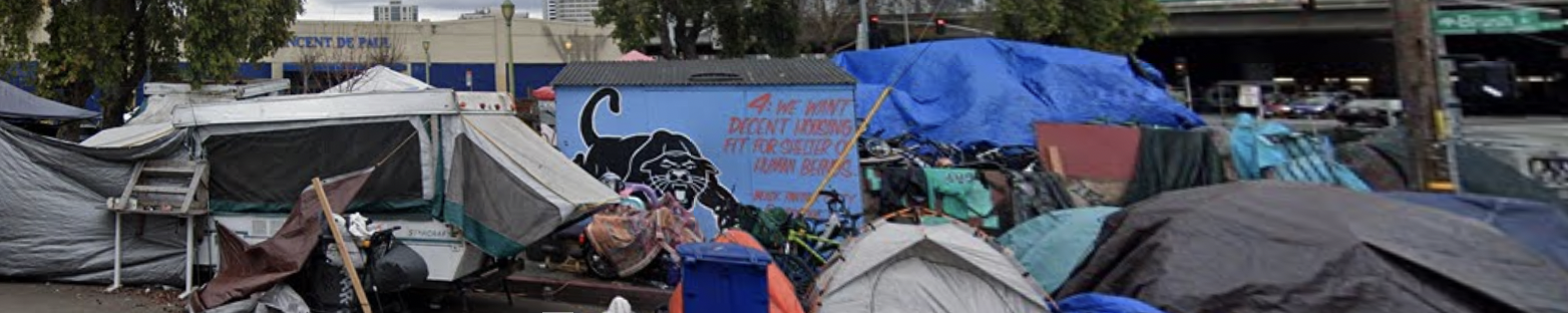 A black-and-blue panther mural amid an encampment of unhoused people.