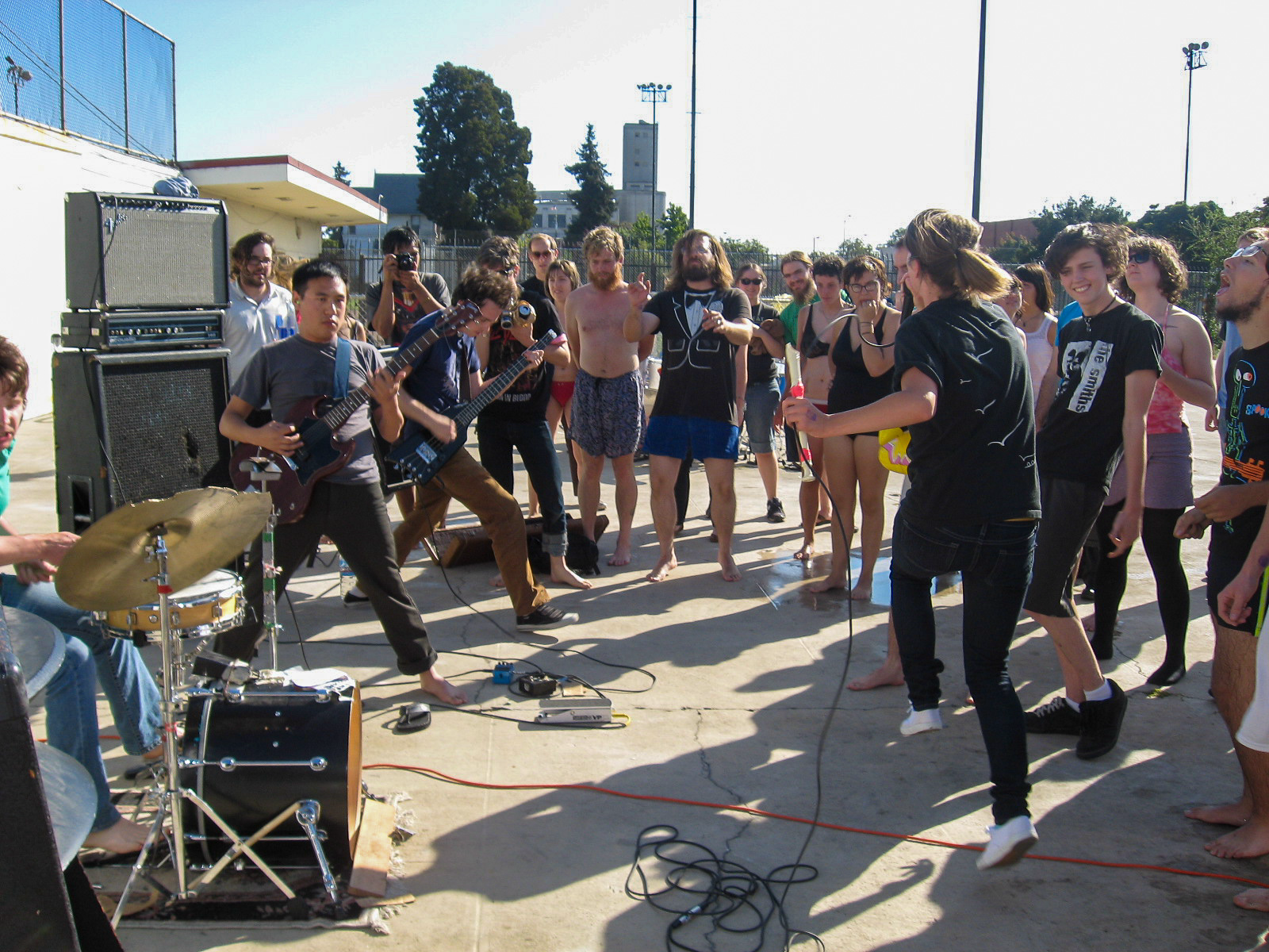 a band playing next to the pool