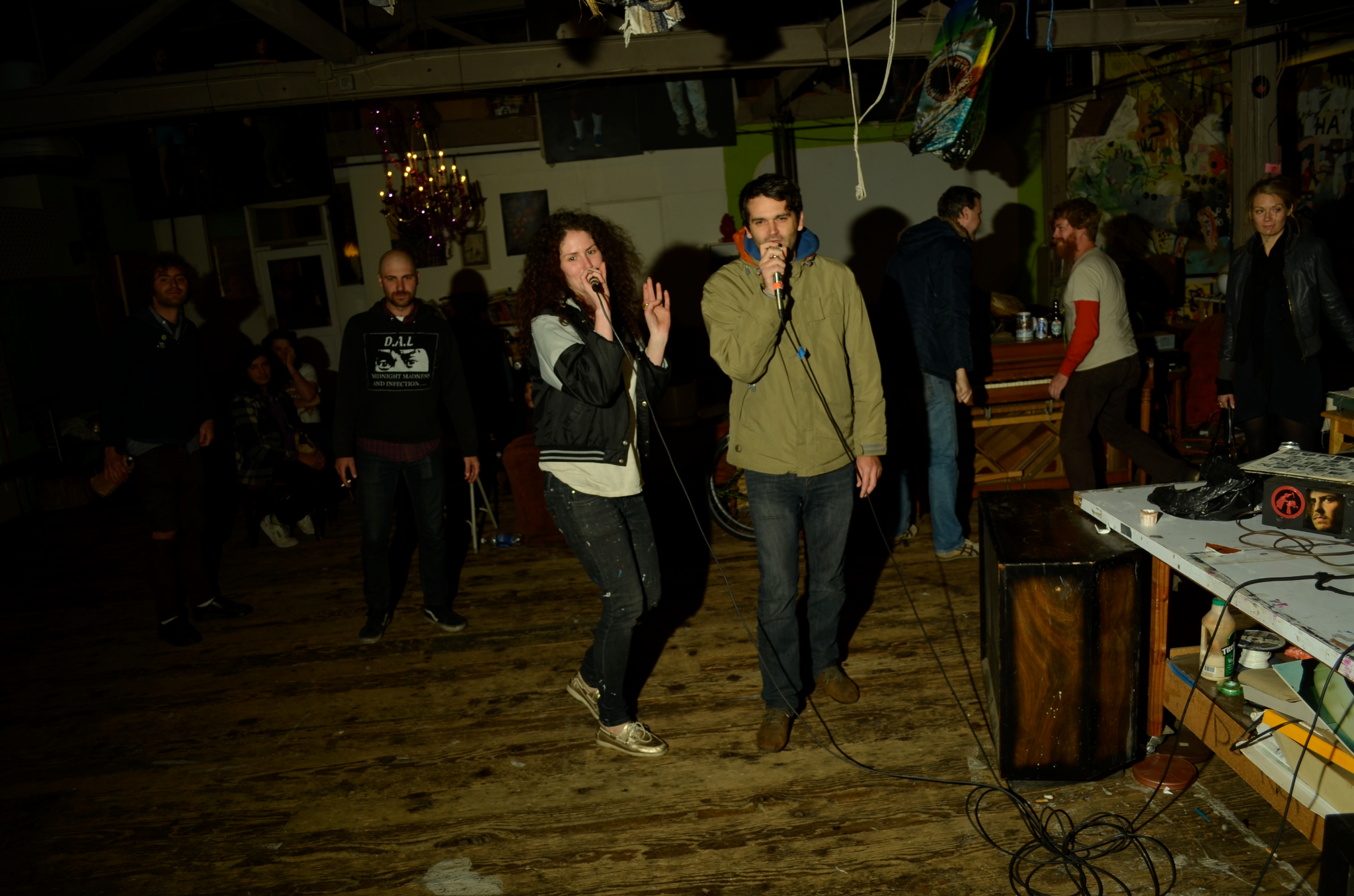 man and woman singing karaoke