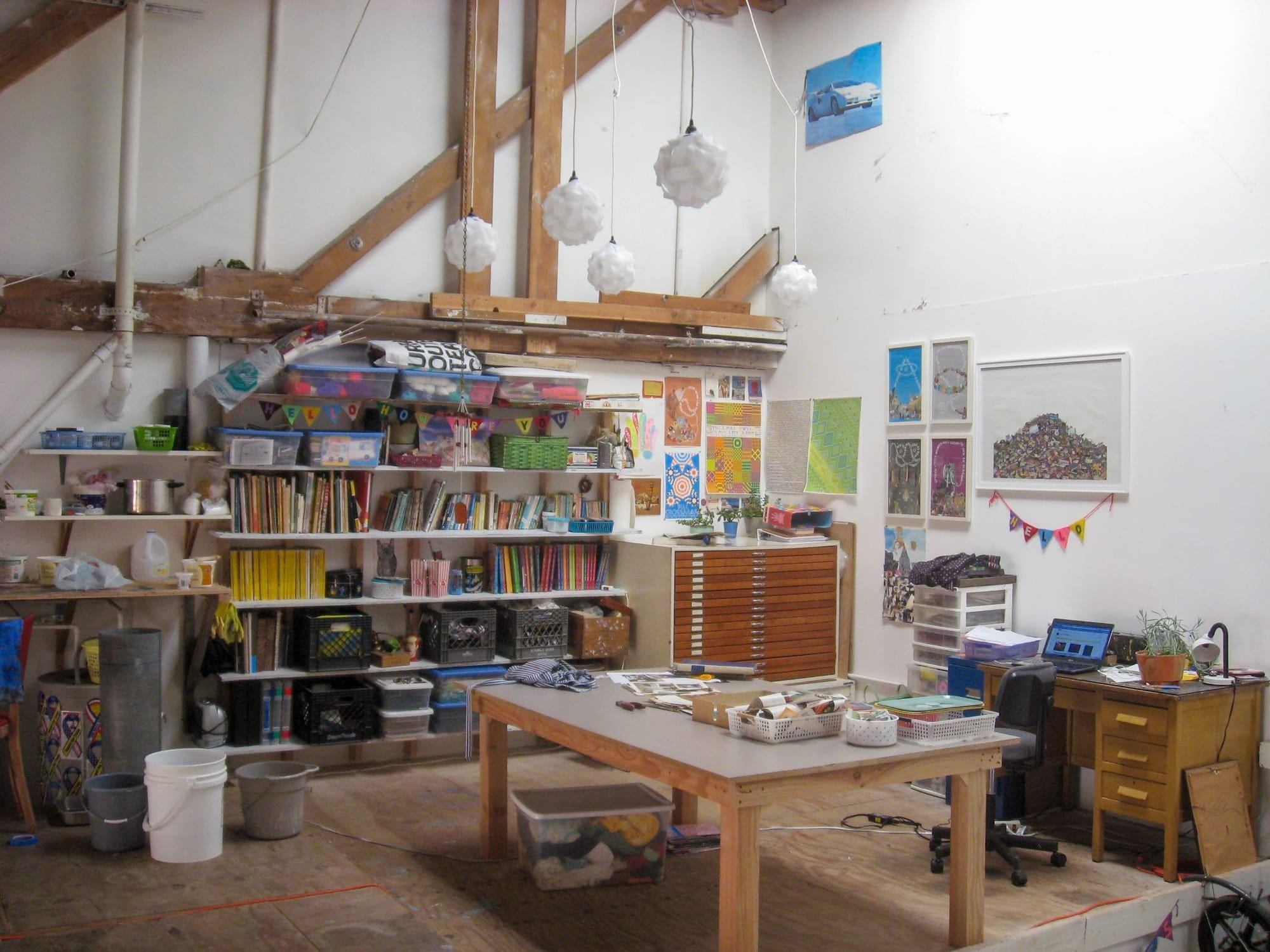 a very full and colorful art studio space