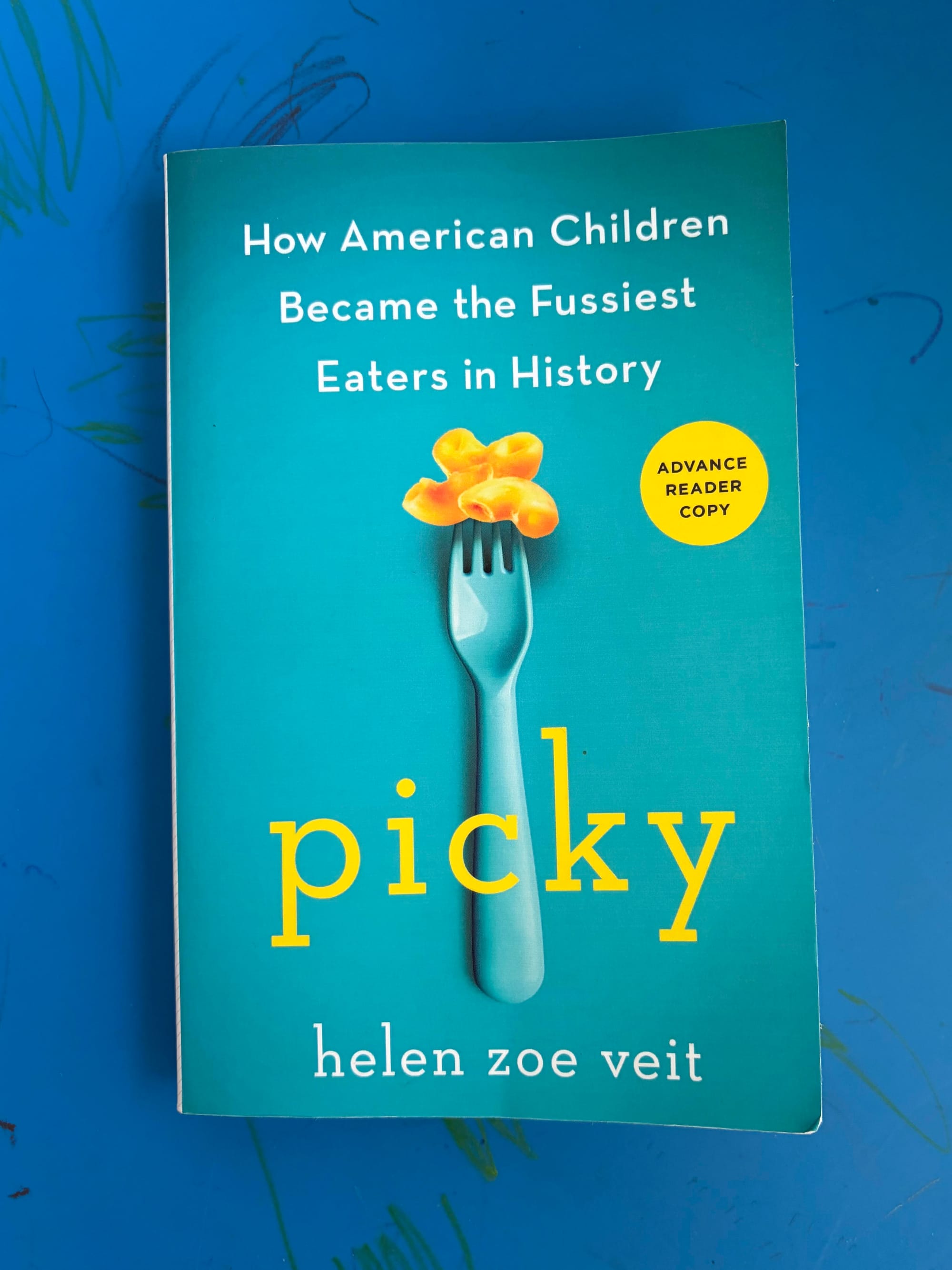 Helen's Picky, on a scribbled-on child’s table as a background