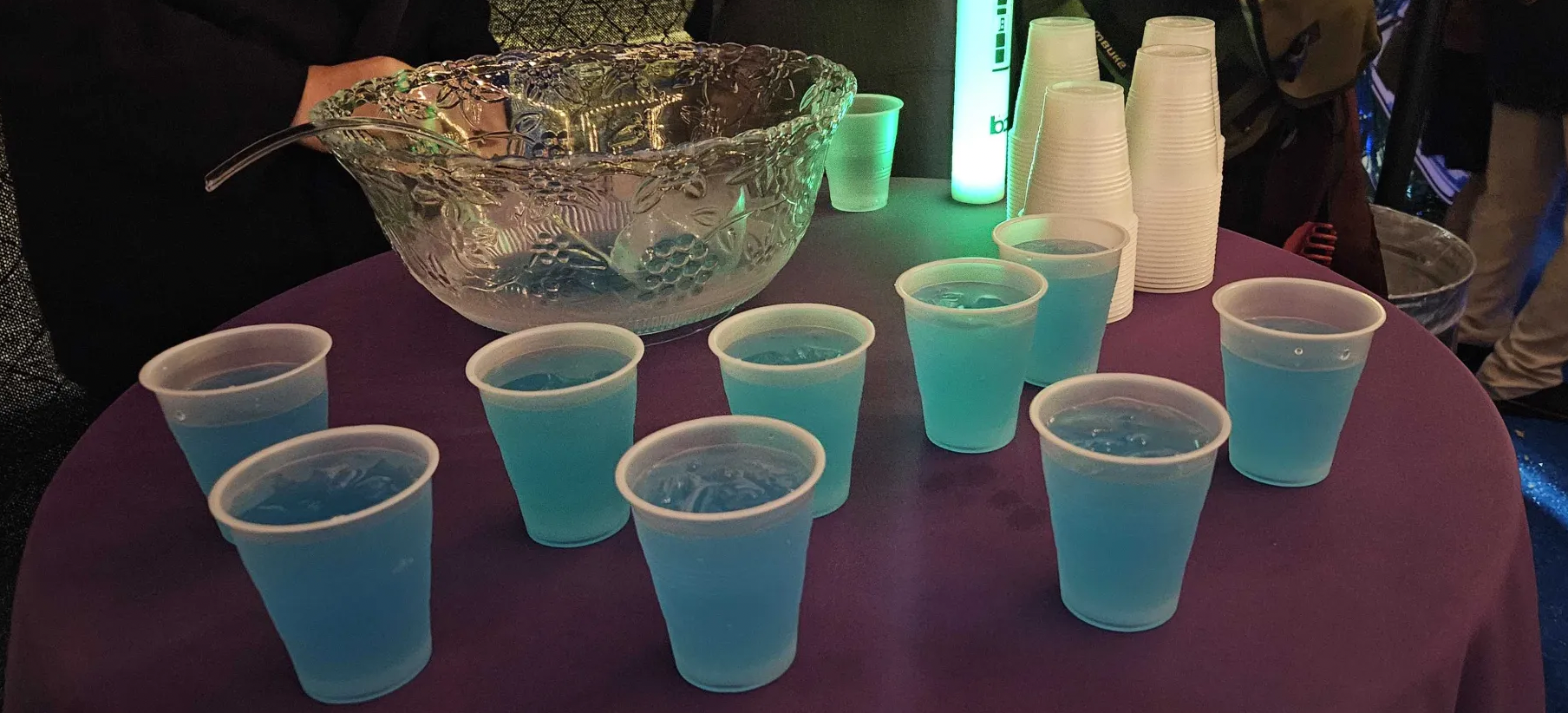blue-colored drinks on a red table