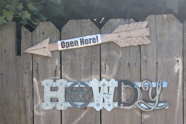 sign: open here, and howdy