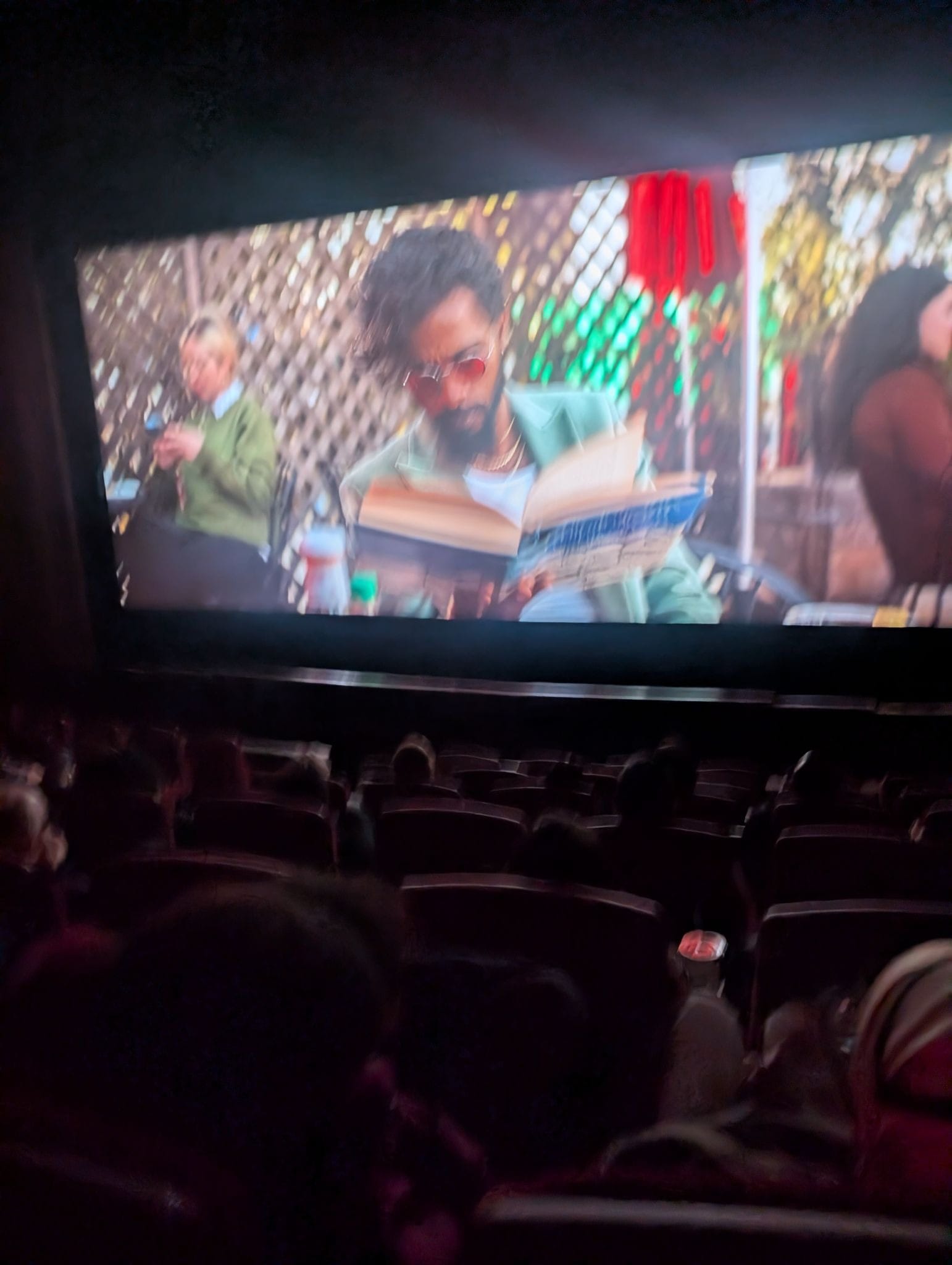 A terrible photograph taken during "I Love Boosters" showing LaKeith Stanfield reading Salman Rushdie's "Midnight's Children."